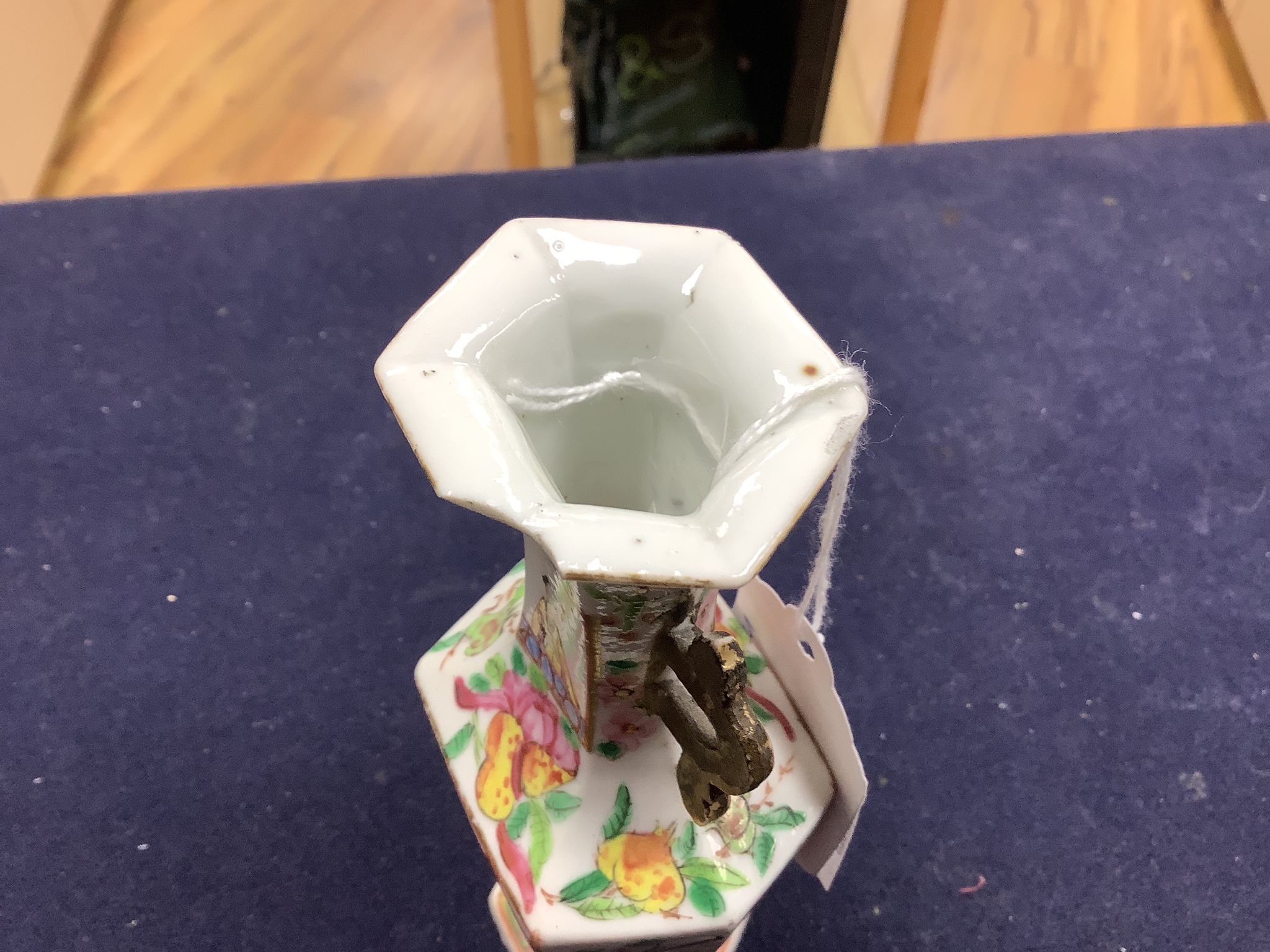 A Chinese famille rose small vase and two cups and saucers